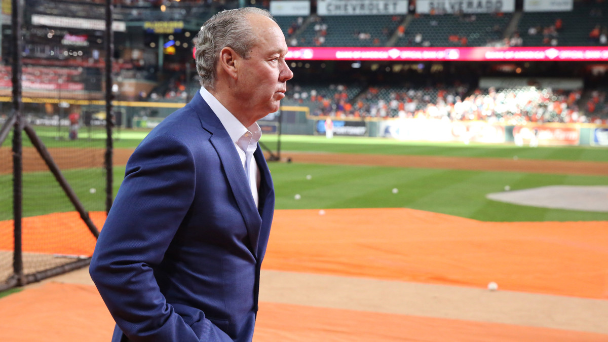 Jim Crane walks off the field during the World Series between the Houston Astros and Washington Nationals.