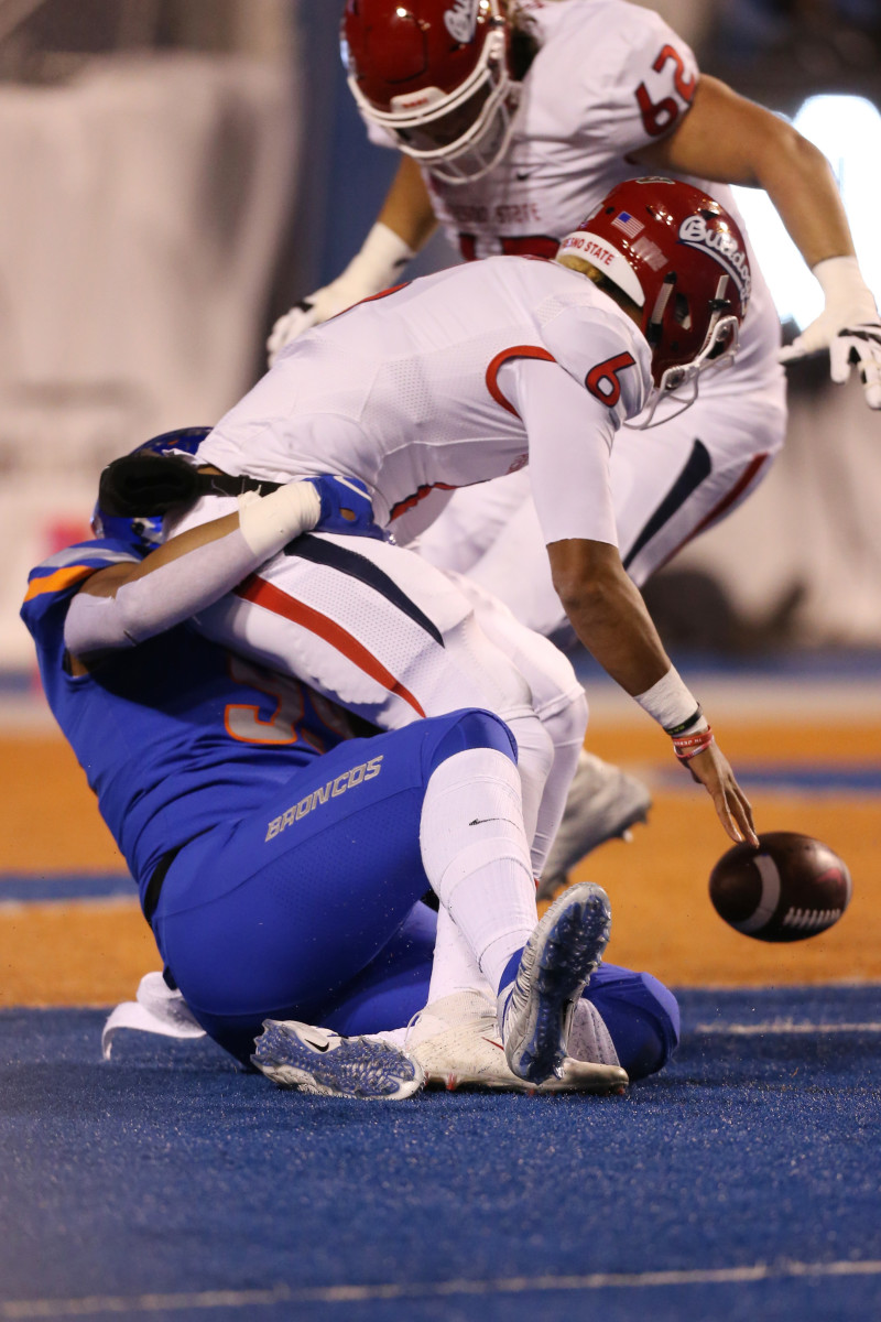 Nov 9, 2018; Boise, ID, USA; Boise State Broncos linebacker Curtis Weaver (99) sacks Fresno State Bulldogs quarterback Marcus McMaryion (6) during the first half of play at Albertsons Stadium. Mandatory Credit: Brian Losness-USA TODAY Sports