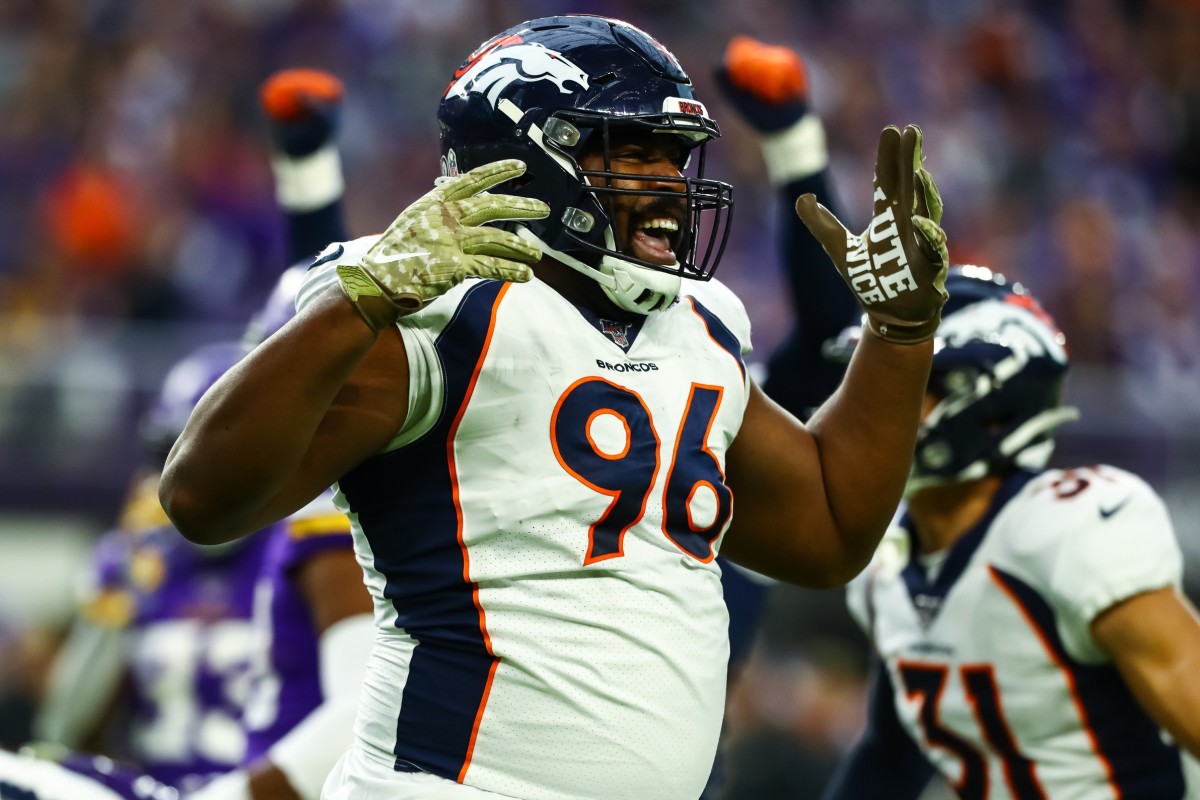 Denver Broncos defensive tackle Shelby Harris (96) celebrates after forcing a fumble against Minnesota Vikings quarterback Kirk Cousins (8) (not pictured) in the second quarter at U.S. Bank Stadium.