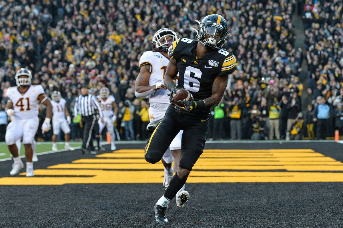 Iowa wide receiver Ihmir Smith-Marsette (6) catches a 6-yard touchdown pass from quarterback Nate Stanley (not pictured) during the second quarter as Minnesota defensive back Coney Durr (16) defends at Kinnick Stadium.