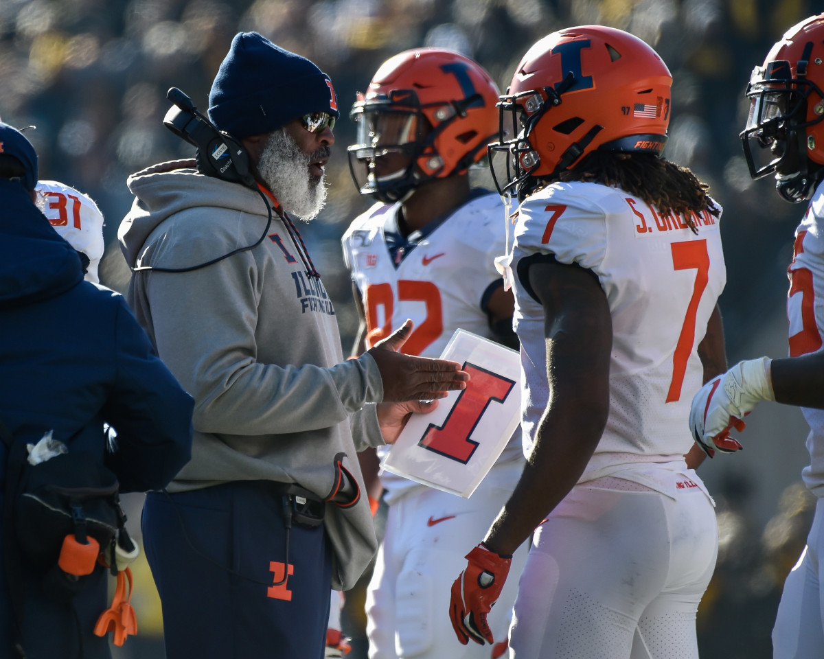Illinois head coach Lovie Smith reacts with defensive back Stanley Green (7) during the second quarter at Kinnick Stadium.
