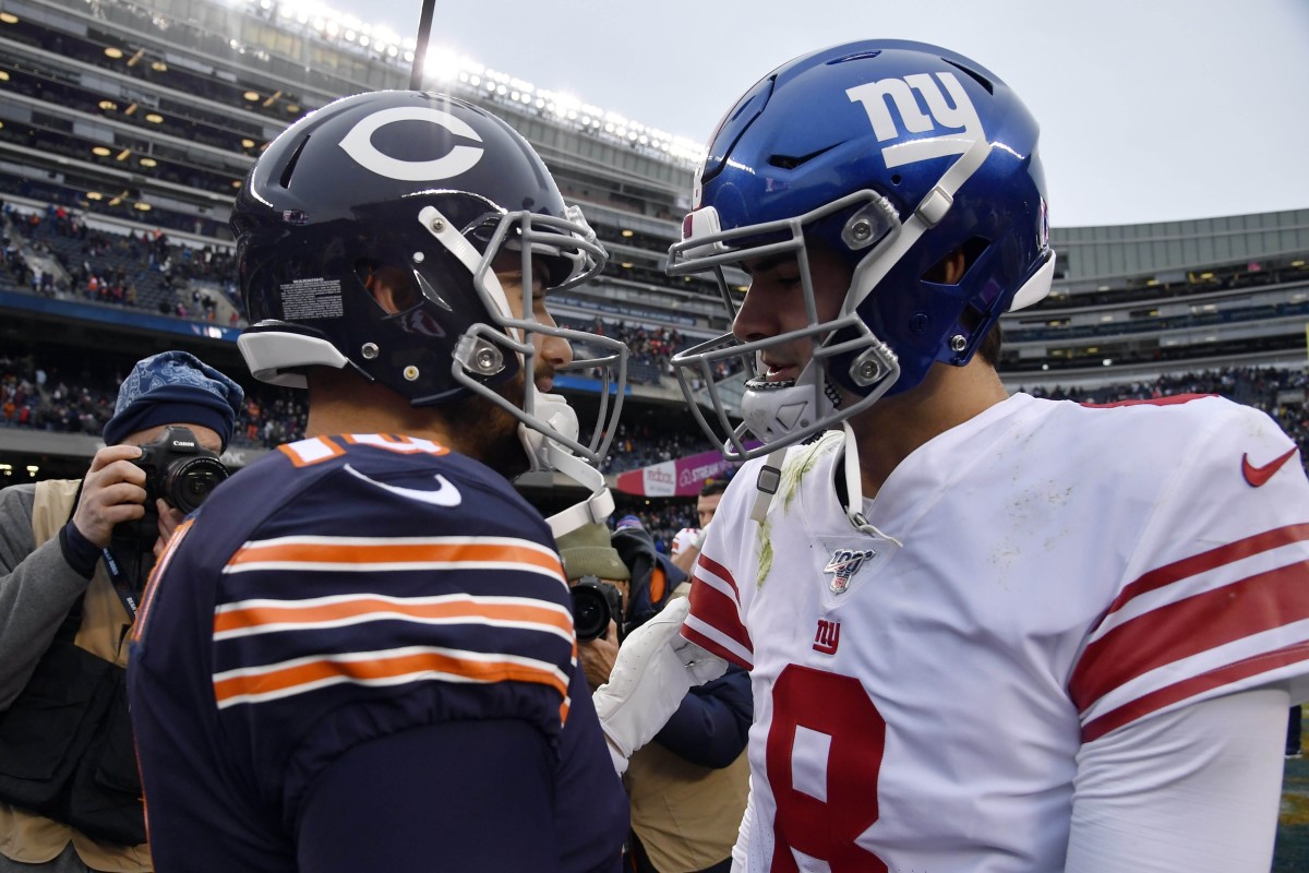 Nov 24, 2019; Chicago, IL, USA; New York Giants quarterback Eli Manning (10) shakes hands with New York Giants quarterback Daniel Jones (8) after the game at Soldier Field. Mandatory Credit: Quinn Harris-USA TODAY Sports