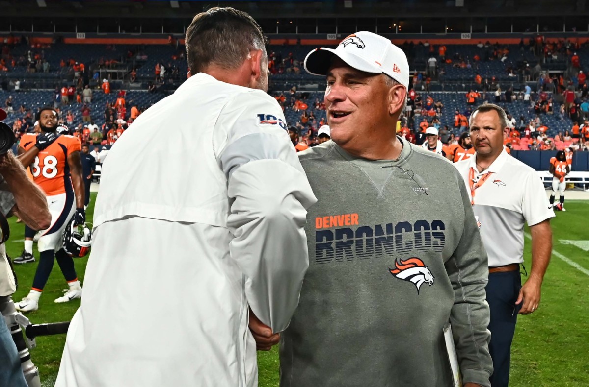 San Francisco 49ers head coach Kyle Shanahan (left) and Denver Broncos head coach Vic Fangio (right) following the preseason game at Broncos Stadium at Mile High.