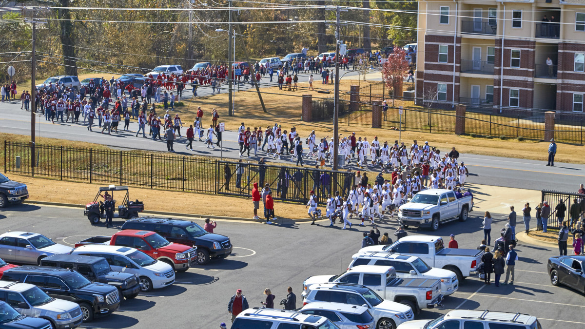 Henderson, Battle visitors in 2019, walked the not-so-long gameday walk.