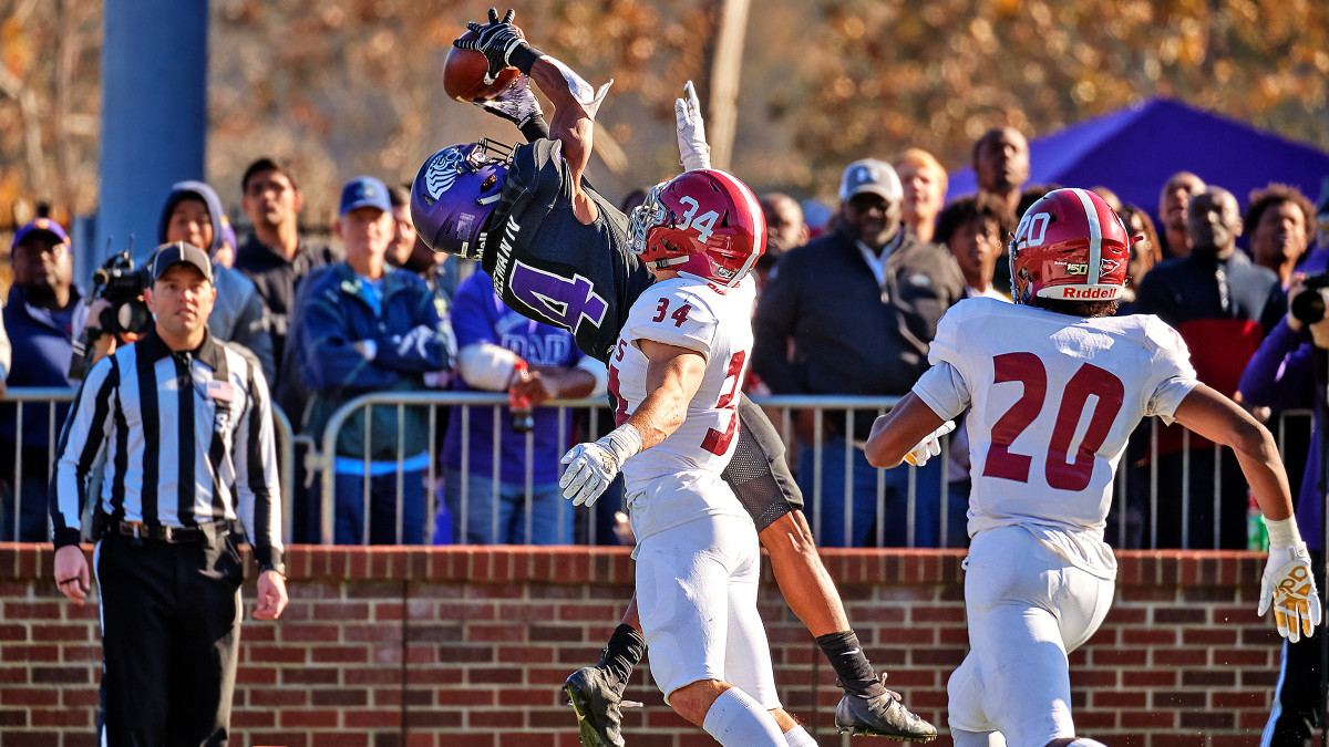 Ouachita's Allie Freeman went high to grab the Tigers' first TD in the 2019 meeting.