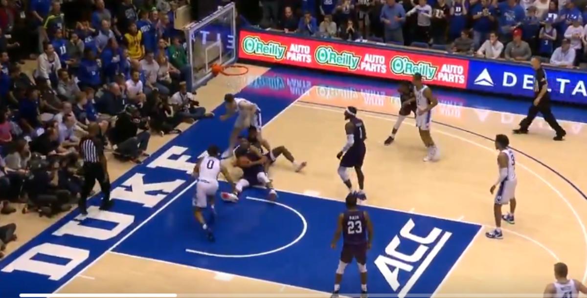 Literally a half second too late, Moore dives. At this point, he should be running up court.