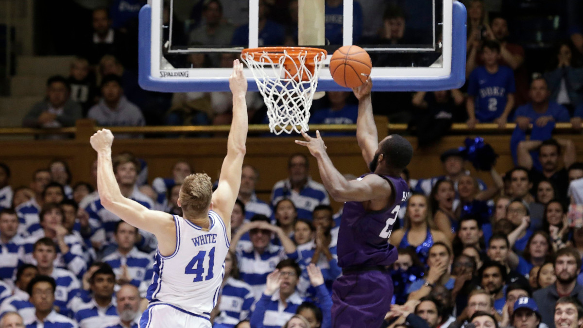 Stephen F. Austin's Nathan Bate makes the game-winning layup against Duke.