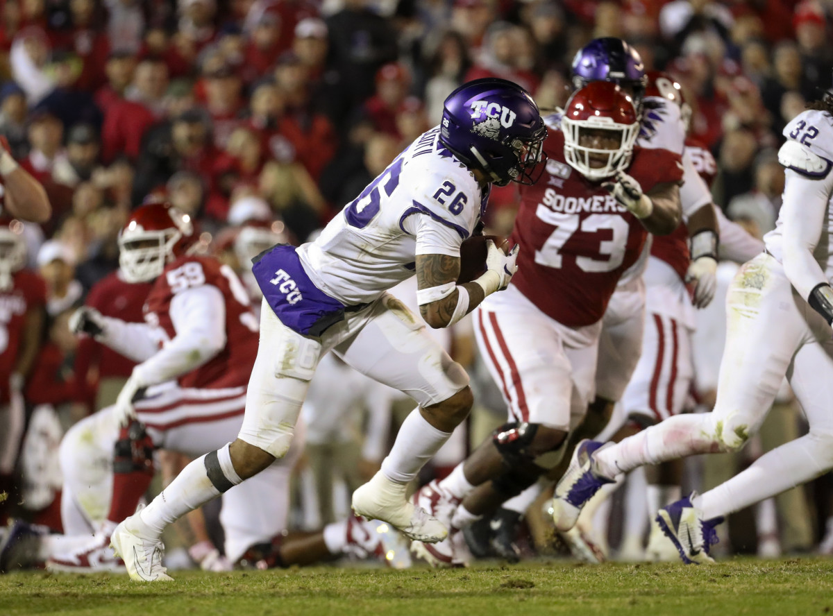 TCU Horned Frogs safety Vernon Scott (26) makes an interception during the fourth quarter against the Oklahoma Sooners at Gaylord Family - Oklahoma Memorial Stadium.