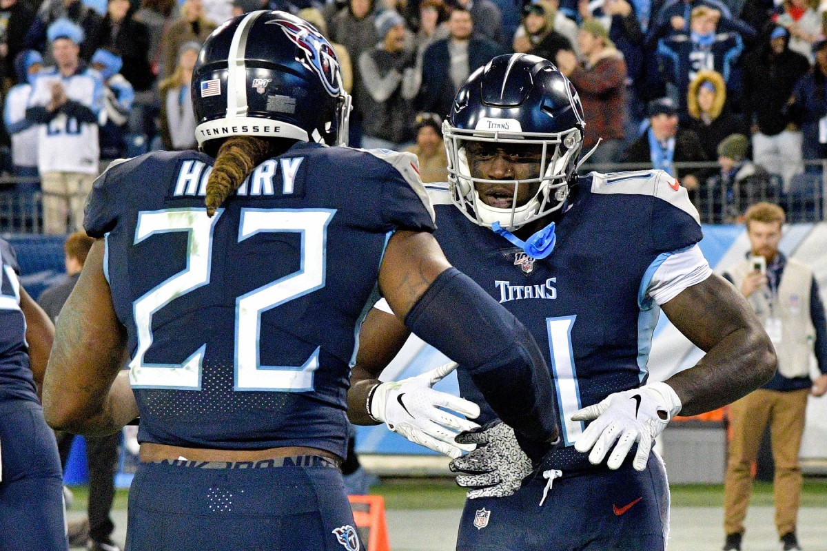 Tennessee Titans wide receiver A.J. Brown (11) rushes for a touchdown against the Jacksonville Jaguars and reacts with Titans running back Derrick Henry (22) during the second half at Nissan Stadium.