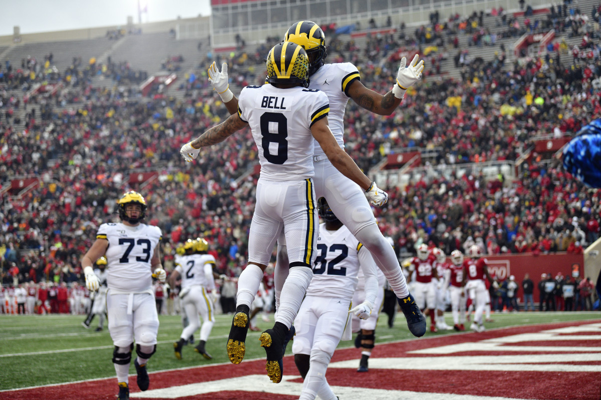 Michigan Wolverines wide receiver Ronnie Bell (8) celebrates a touchdown with his teammates during the first quarter of the game against the Indiana Hoosiers at Memorial Stadium