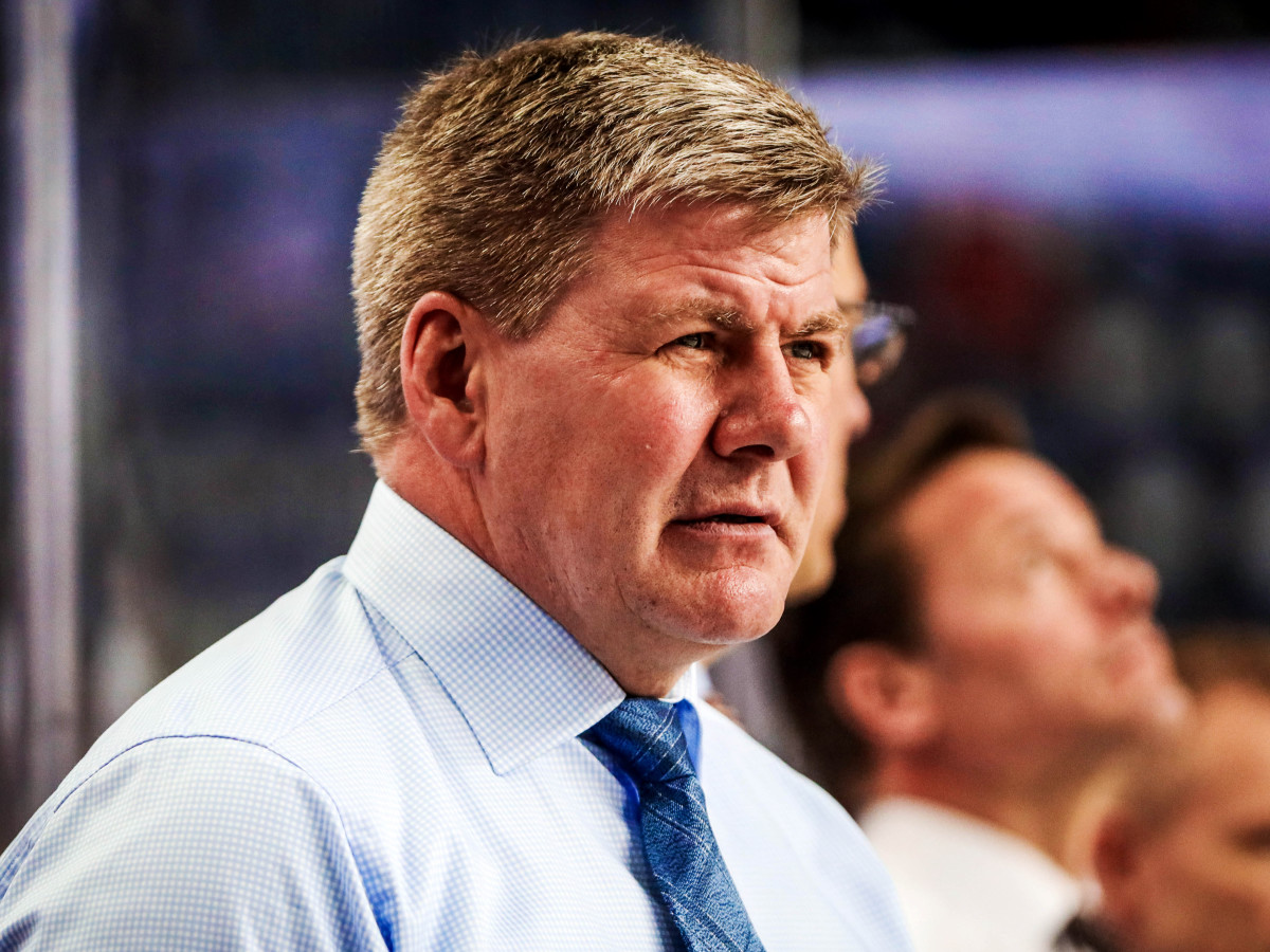Feb 20, 2019; Calgary, Alberta, CAN; Calgary Flames head coach Bill Peters on his bench during the warmup period against the New York Islanders at Scotiabank Saddledome. Mandatory Credit: Sergei Belski-USA TODAY Sports