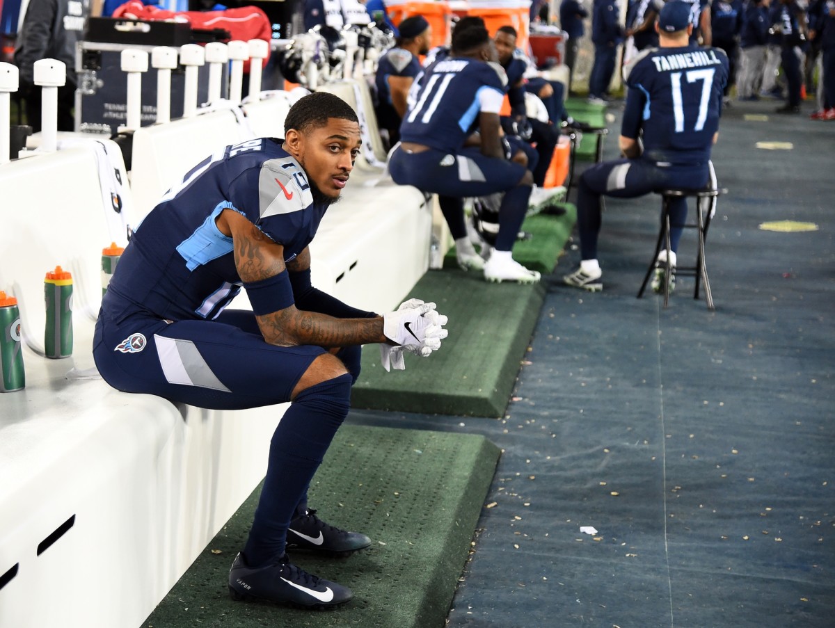 Tennessee Titans wide receiver Tajae Sharpe (19) sits on the bench away from teammates during the second half against the Jacksonville Jaguars at Nissan Stadium.