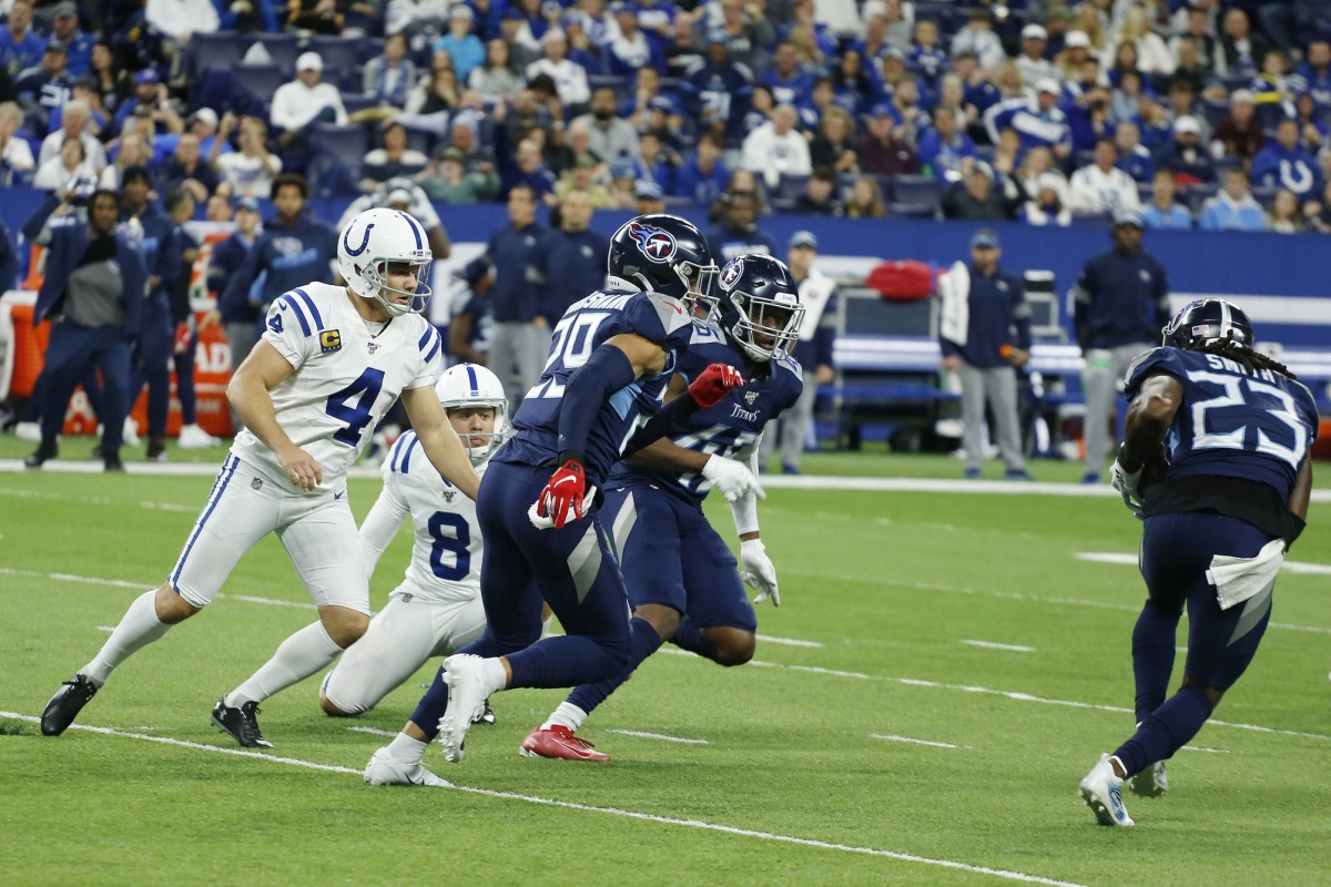 Tennessee Titans cornerback Tye Smith (23) picks up a blocked Indianapolis Colts Adam Vinatieri (4) field goal attempt and runs it back for a touchdown against the Indianapolis Colts during the fourth quarter at Lucas Oil Stadium.