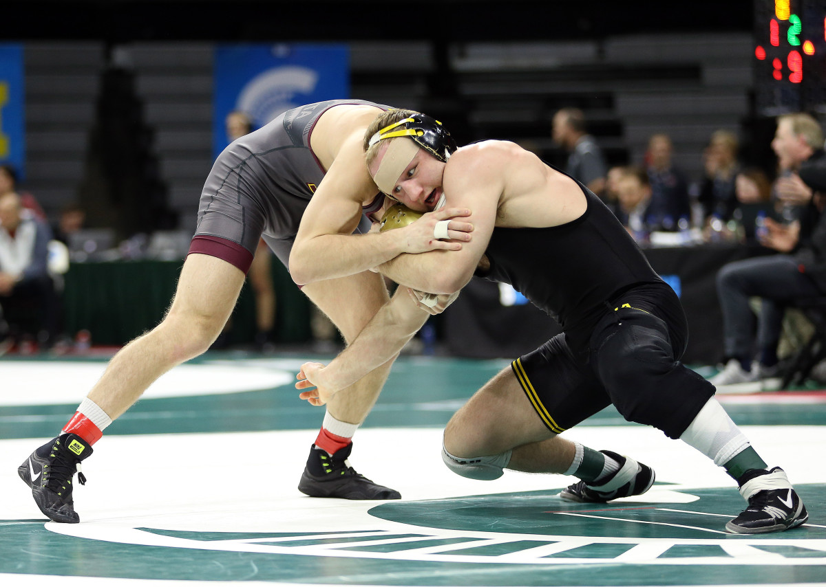 Iowa's Alex Marinelli (right), ranked No. 2 at 165, will face Wisconsin's Evan Wick, ranked No. 3, in Sunday's dual meet.