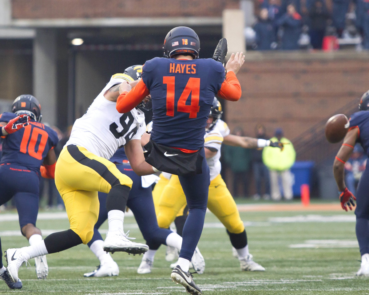 Iowa Hawkeyes defensive end A.J. Epenesa (94) blocks the punt from Illinois Fighting Illini punter Blake Hayes (14) during the second quarter at Memorial Stadium.