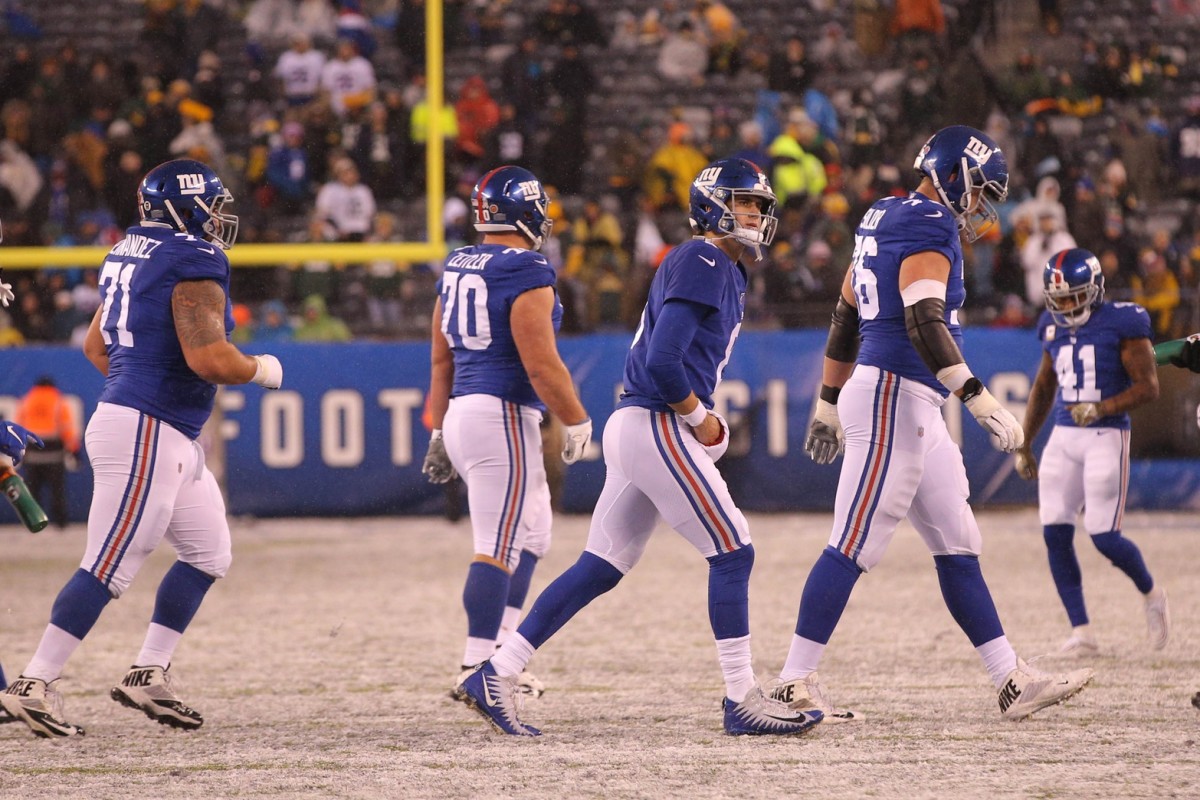 Dec 1, 2019; East Rutherford, NJ, USA; New York Giants quarterback Daniel Jones (8) and the offense walk off the field after failing to convert a fourth down against the Green Bay Packers during the fourth quarter at MetLife Stadium.