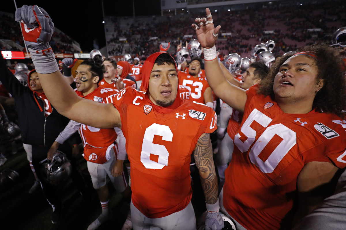 Utah defensive end Bradley Anae (6) and teammates celebrate their win over Colorado.