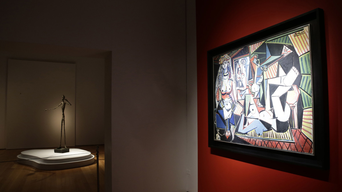 Pablo Picasso's painting 'Les Femmes D'alger and Alberto Giacometti's L'homme Au Doigt sculpture on display at auction at Christie's in New York
