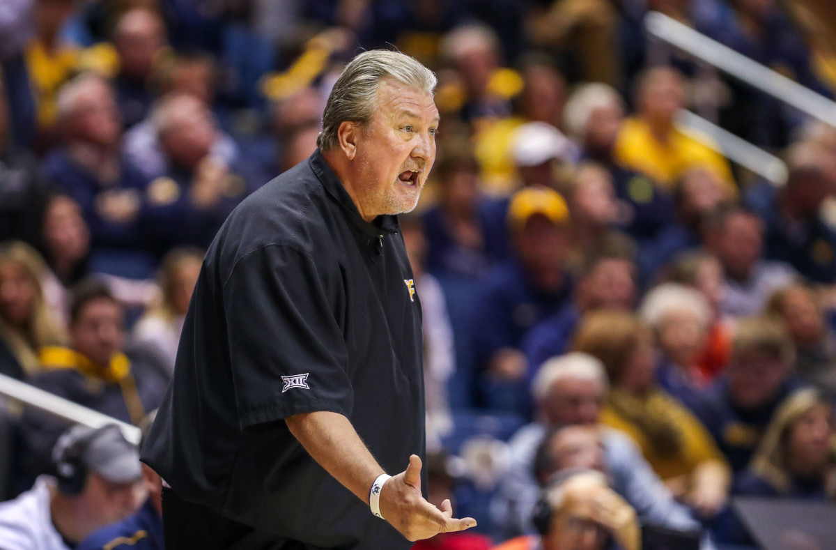 West Virginia Mountaineers head coach Bob Huggins yells from the bench during the second half against the Rhode Island Rams at WVU Coliseum.