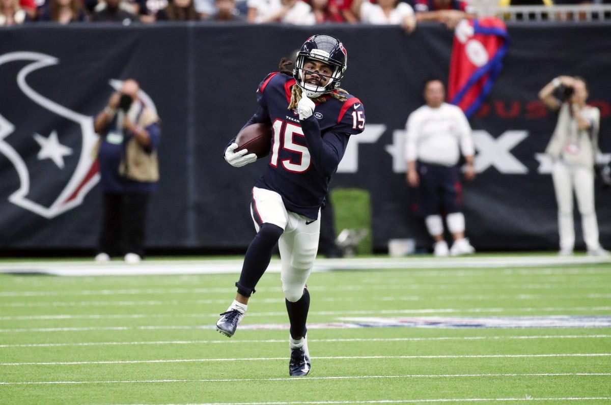 Houston Texans wide receiver Will Fuller (15) runs with the ball during the first half against the Atlanta Falcons at NRG Stadium.