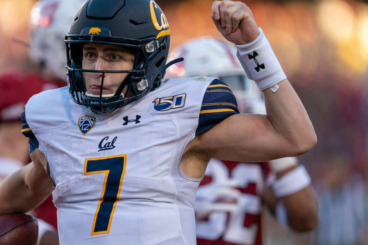 California quarterback Chase Garbers (7) celebrates after scoring a touchdown during the fourth quarter against Stanford at Stanford Stadium.