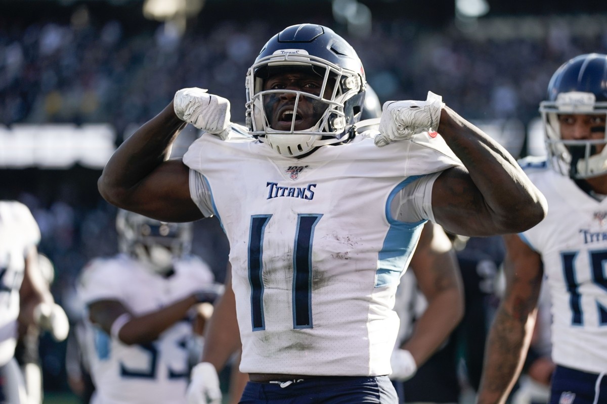 Tennessee Titans wide receiver A.J. Brown (11) celebrates after scoring a touchdown against the Oakland Raiders during the second quarter at Oakland Coliseum.