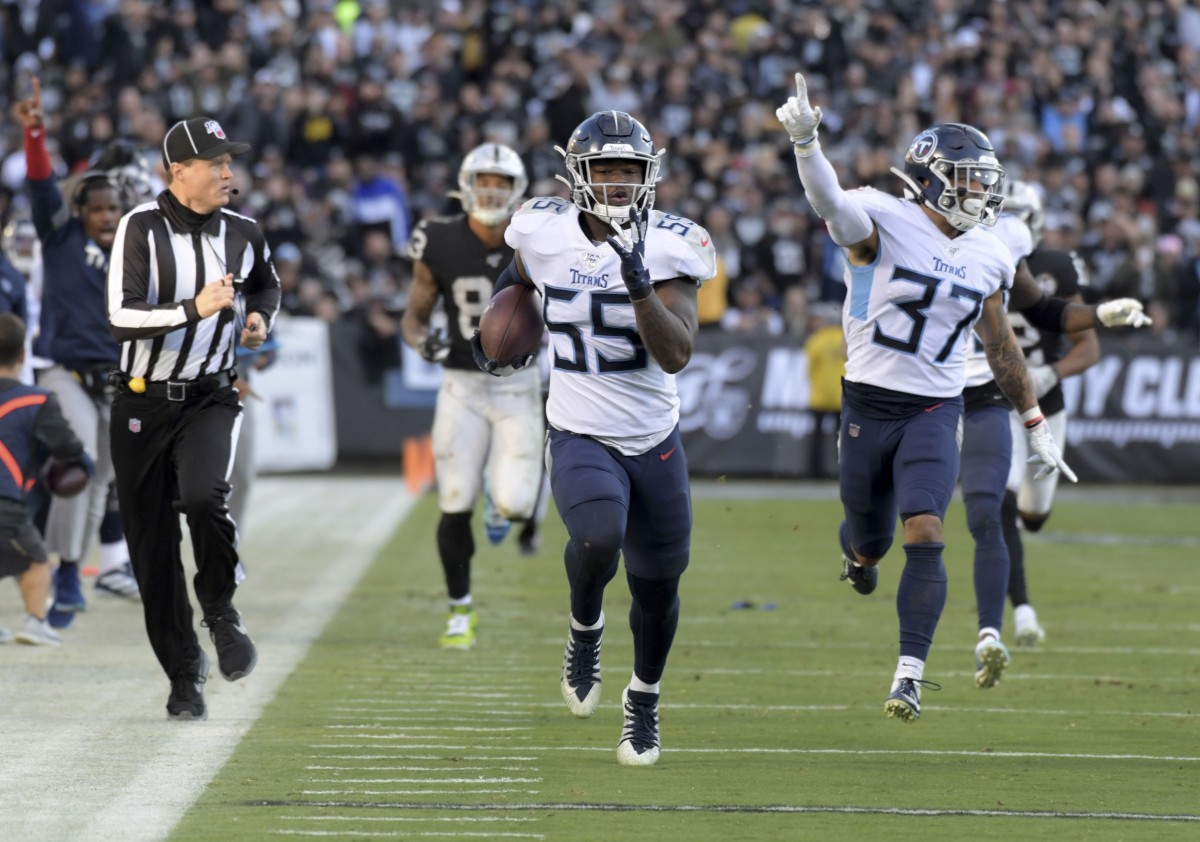 Tennessee Titans inside linebacker Jayon Brown (55) scores on a 46-yard fumble recovery as defensive back Amani Hooker (37) celebrates in the fourth quarter against the Oakland Raiders at Oakland-Alameda Coliseum. The Titans defeated the Raiders 42-21.