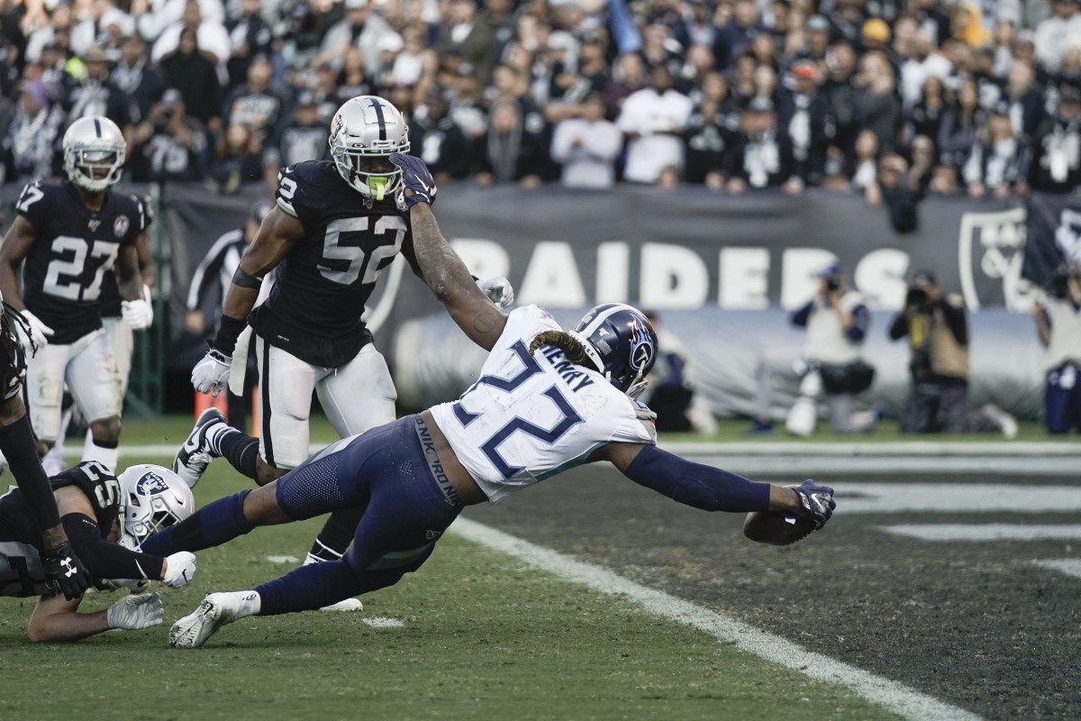 Tennessee Titans running back Derrick Henry (22) stretches out for a touchdown against the Oakland Raiders during the third quarter at Oakland Coliseum.