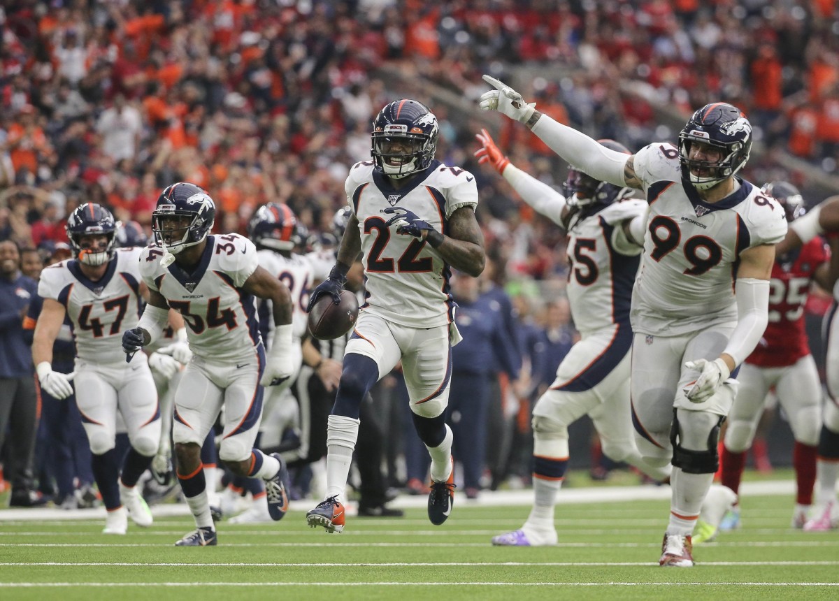 Denver Broncos strong safety Kareem Jackson (22) celebrates with teammates after an interception during the fourth quarter against the Houston Texans at NRG Stadium.