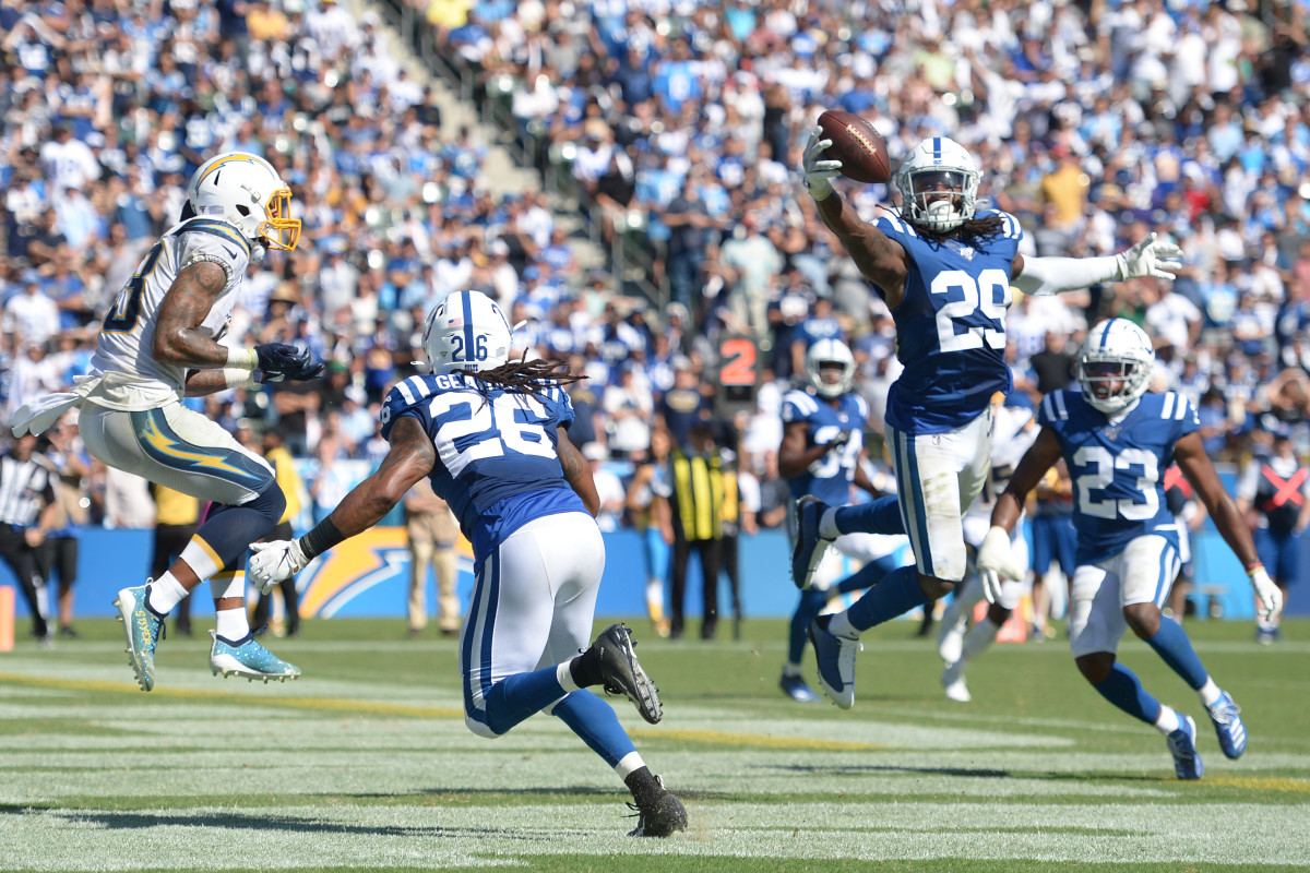 Sep 8, 2019; Carson, CA, USA; Indianapolis Colts free safety Malik Hooker (29) intercepts a pass intended for Los Angeles Chargers wide receiver Keenan Allen (13) as strong safety Clayton Geathers (26) defends Allen in the /4qq/ at Dignity Health Sports Park. Mandatory Credit: Jake Roth-USA TODAY Sports