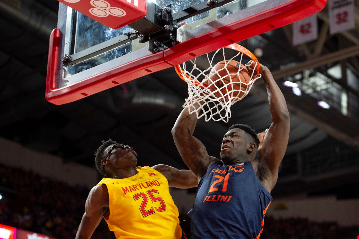 Illinois Fighting Illini center Kofi Cockburn (21) dunks as Maryland Terrapins forward Jalen Smith (25) defends during the first half at XFINITY Center.
