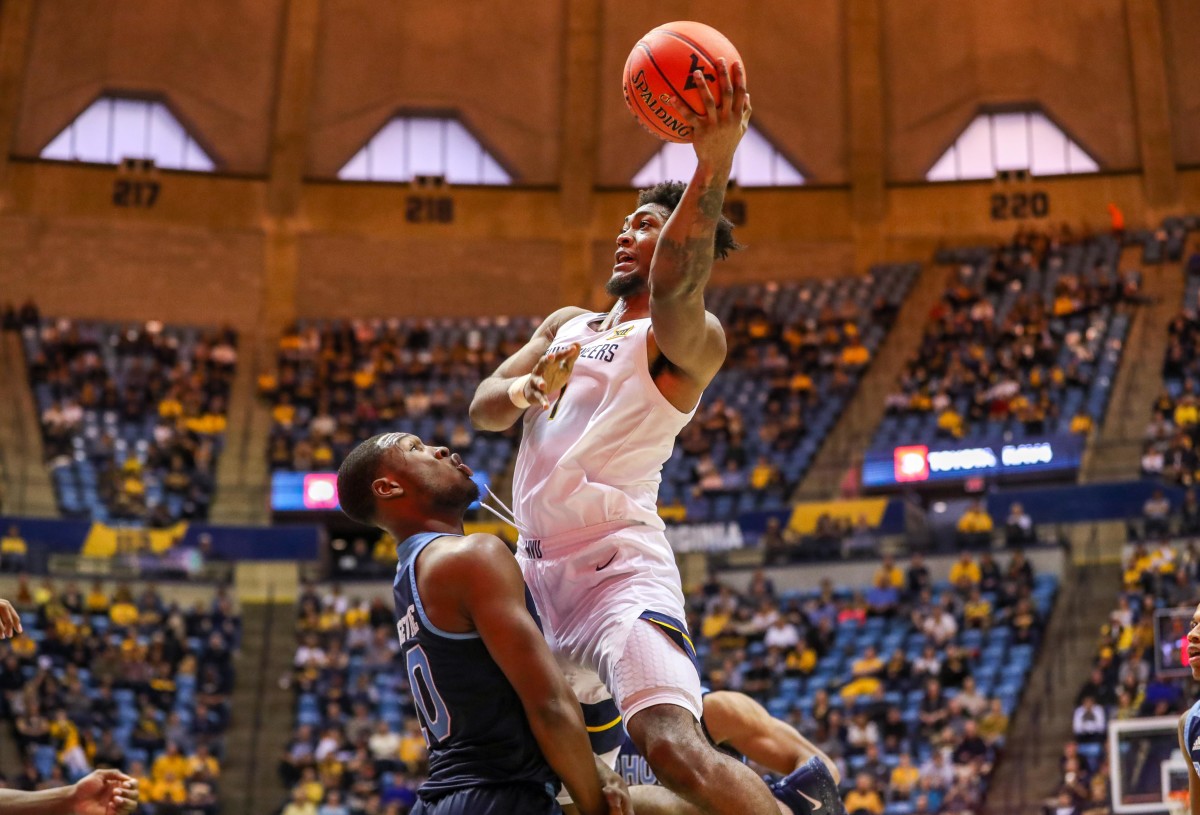 West Virginia Mountaineers forward Derek Culver (1) shoots during the second half against the Rhode Island Rams at WVU Coliseum.