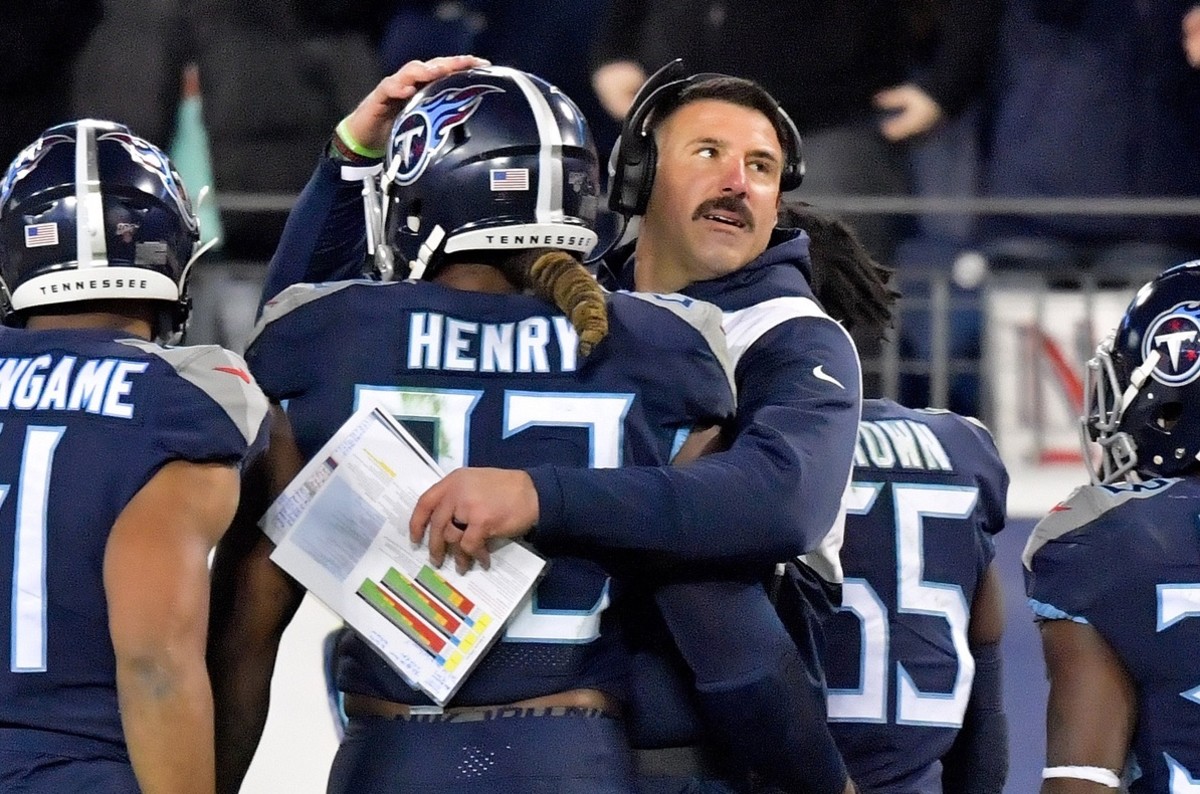 Tennessee Titans head coach Mike Vrabel greets Tennessee Titans running back Derrick Henry (22) after he scores a touchdown against the Jacksonville Jaguars during the second half at Nissan Stadium.