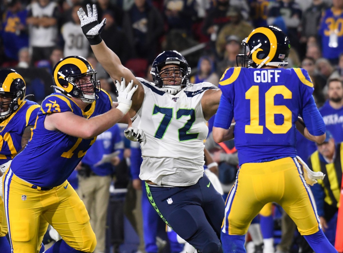 Seattle Seahawks defensive tackle Al Woods (72) pressures Los Angeles Rams quarterback Jared Goff (16) during the third quarter at Los Angeles Memorial Coliseum. Block on the play is Los Angeles Rams offensive guard David Edwards (73).