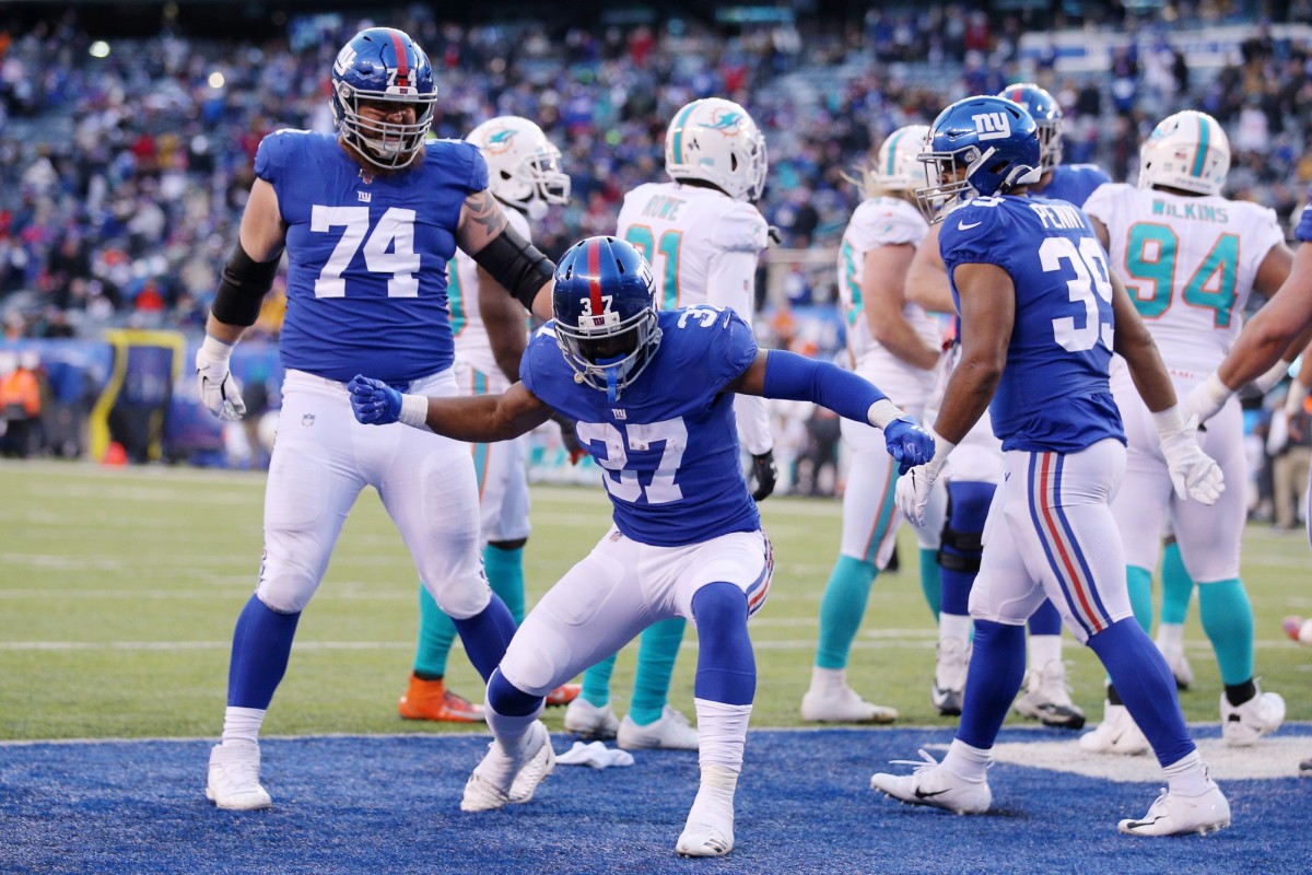 Dec 15, 2019; East Rutherford, NJ, USA; New York Giants running back Javorius Allen (37) celebrates his touchdown against the Miami Dolphins during the fourth quarter at MetLife Stadium.