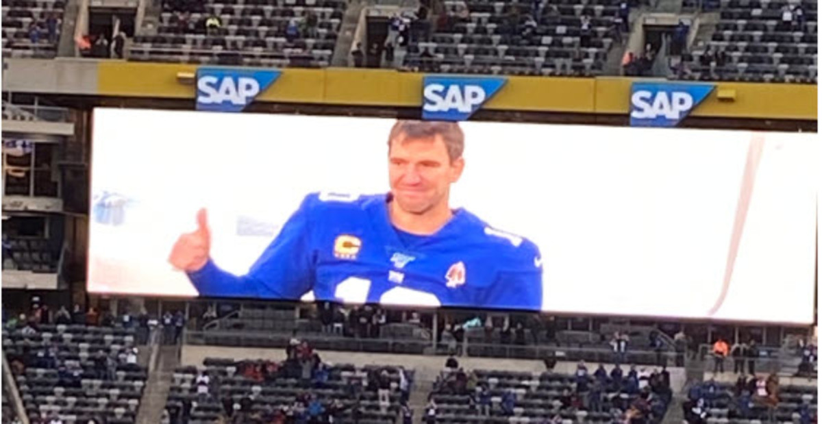 Eli Manning is shown on the MetLife Stadium scoreboard giving the crowd the thumbs-up sign after he came out of the game late in the fourth quarter.