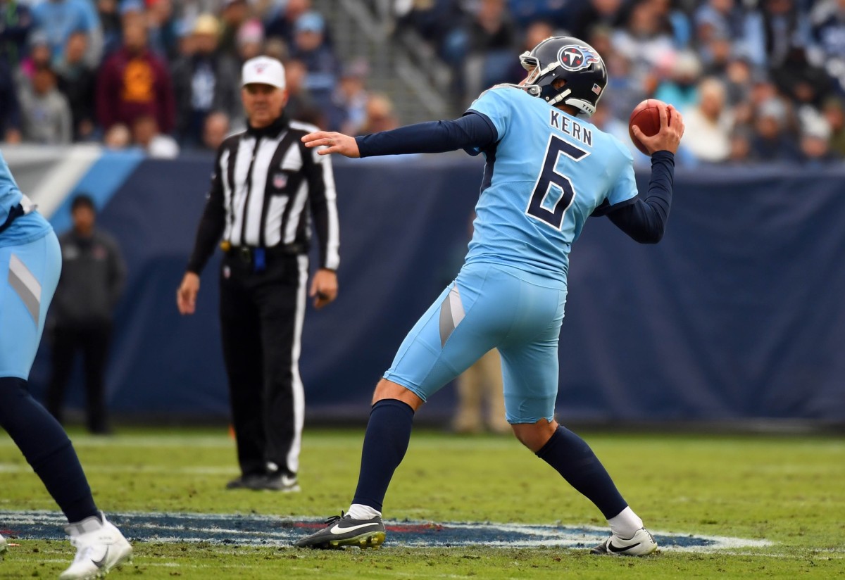 Tennessee Titans punter Brett Kern (6) attempts a pass on a fake punt during the first half against the Houston Texans at Nissan Stadium.