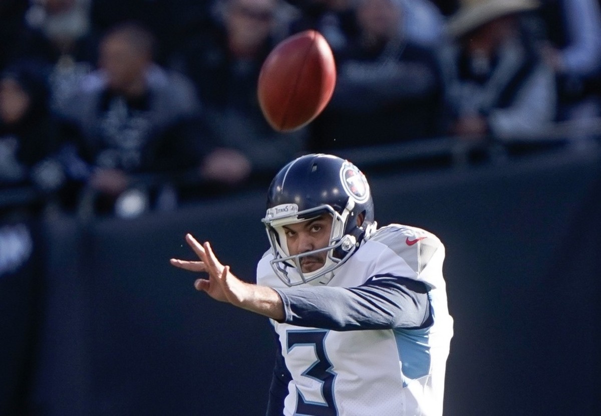 Tennessee Titans kicker Ryan Santoso (3) kicks the ball against the Oakland Raiders during the second quarter at Oakland Coliseum.