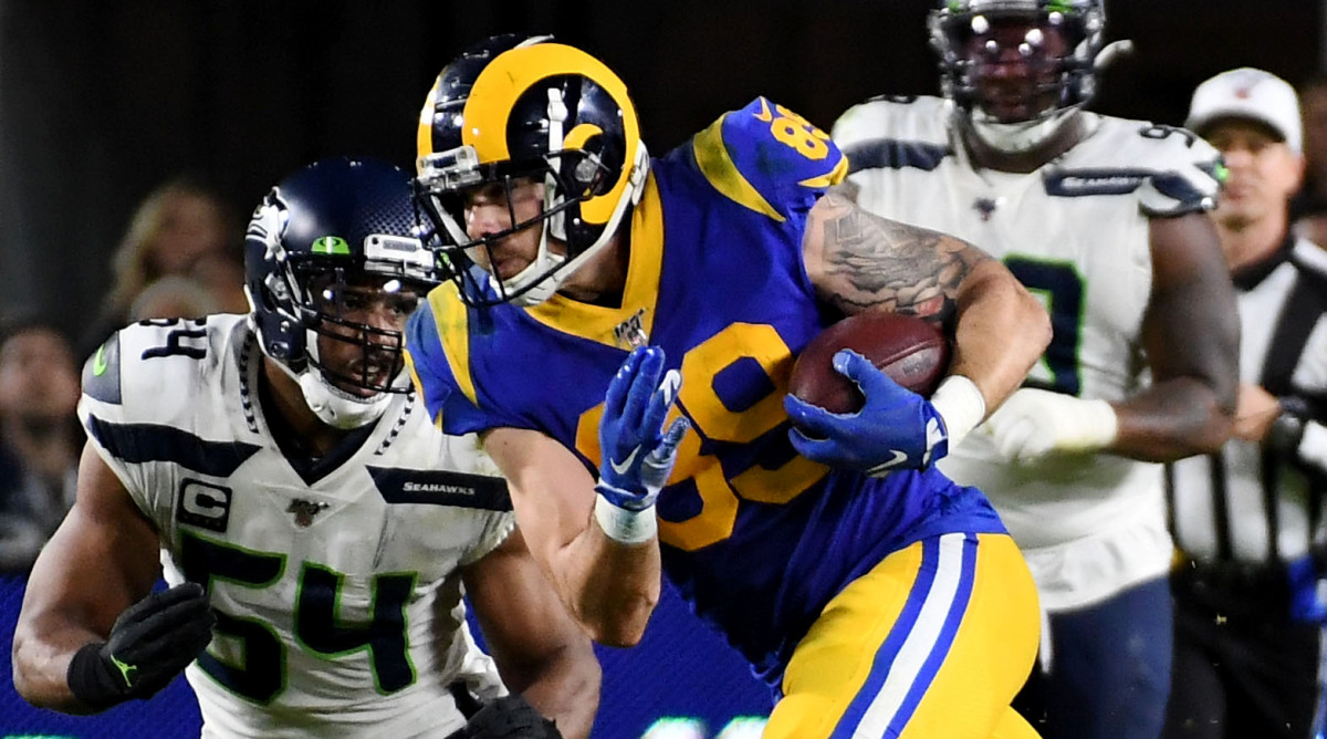 Dec 8, 2019; Los Angeles, CA, USA; Los Angeles Rams tight end Tyler Higbee (89) runs with the ball against Seattle Seahawks middle linebacker Bobby Wagner (54)  in the second half of a NFL game at Los Angeles Memorial Coliseum. Mandatory Credit: Richard Mackson-USA TODAY Sports