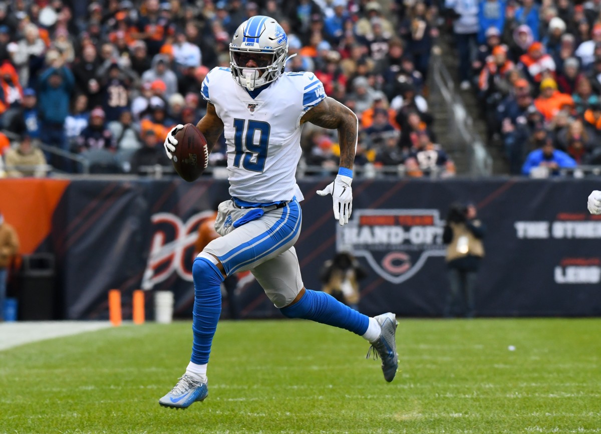 Detroit Lions wide receiver Kenny Golladay (19) runs with the Baltimore after a catch against the Chicago Bears during the first quarter at Soldier Field.
