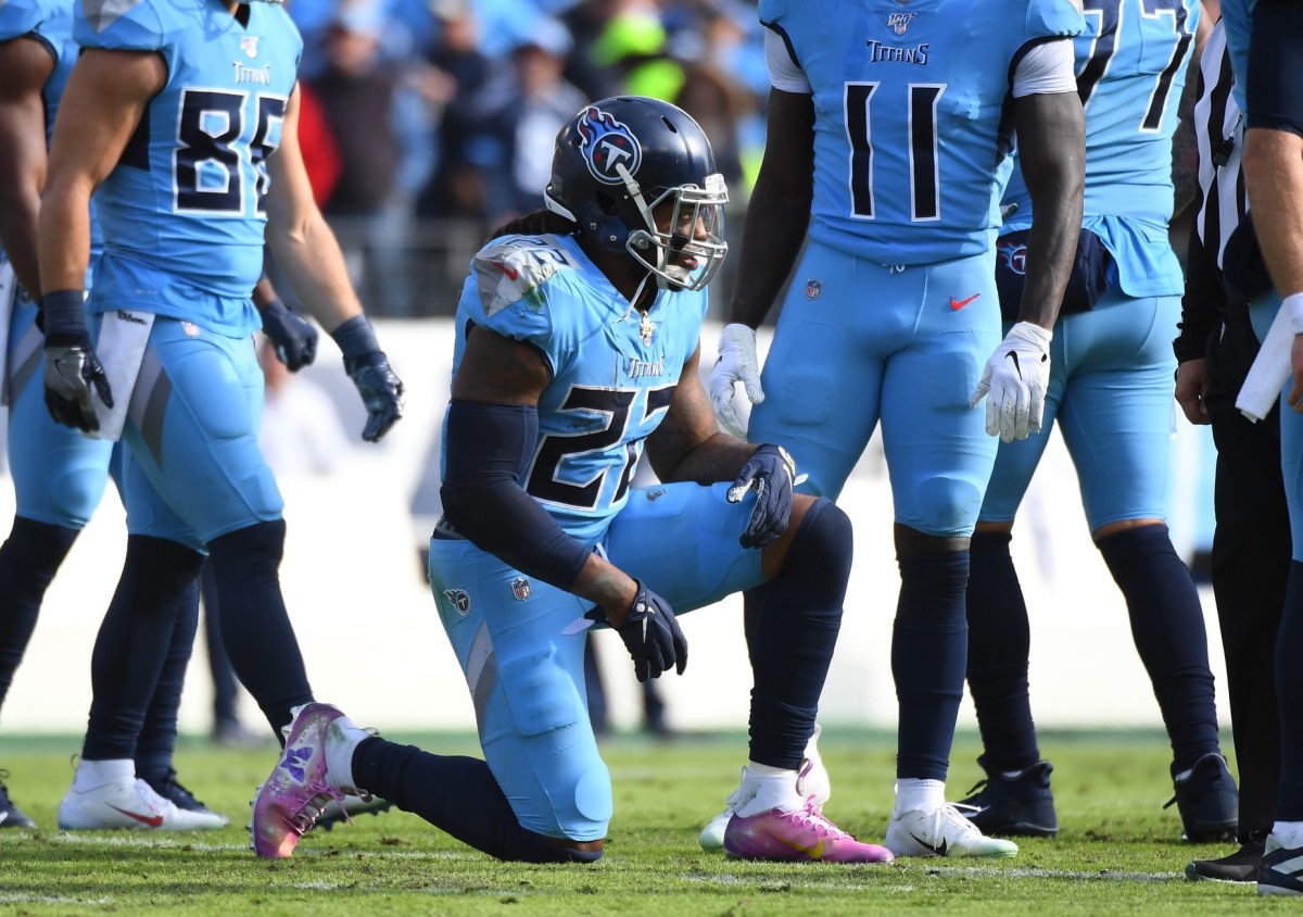 Tennessee Titans running back Derrick Henry (22) on one knee after a short run during the first half against the Houston Texans at Nissan Stadium.