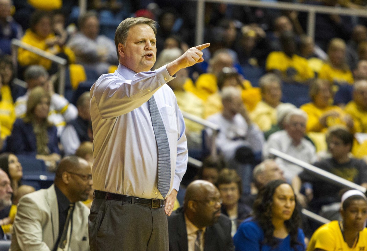 West Virginia Mountaineers head coach Mike Carey reacts on the sidelines during the second half against the Baylor Bears at WVU Coliseum.