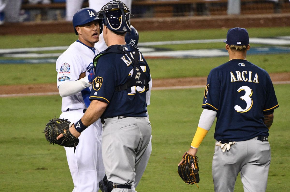 Erik Kratz holds Manny Machado back in NLCS as benches clear