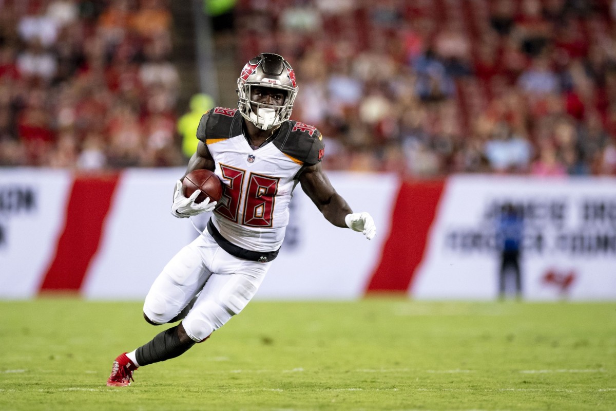 Tampa Bay Buccaneers running back Shaun Wilson (38) catches a pass and turns upfield during the first half against the Jacksonville Jaguars at Raymond James Stadium.