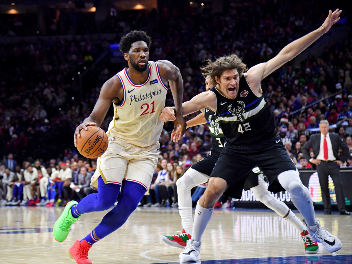 Dec 25, 2019; Philadelphia, Pennsylvania, USA; Philadelphia 76ers center Joel Embiid (21) drives to the basket against Milwaukee Bucks center Robin Lopez (42) during the second quarter at Wells Fargo Center. Mandatory Credit: Eric Hartline-USA TODAY Sports