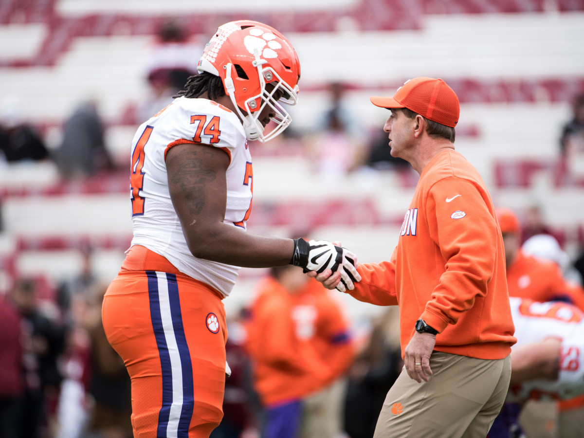 Clemson head coach Dabo Swinney shakes hands with offensive lineman John Simpson (74) before an NCAA college football game against South Carolina, in Columbia, S.C. Clemson defeated South Carolina 38-3
 — 30 Nov 2019