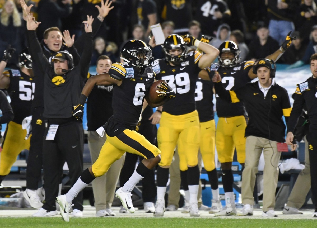 Iowa's Ihmir Smith-Marsette returns a kickoff 98 yards for a touchdown. (Mandatory credit: USA TODAY SPORTS.)