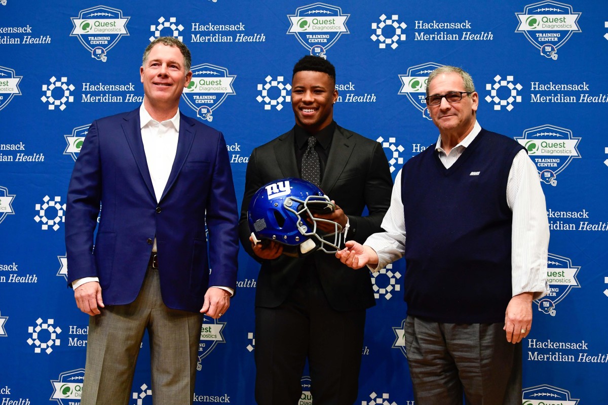 Apr 28, 2018; East Rutherford, NJ, USA; New York Giants head coach Pat Shurmur (left), first-round draft pick Saquon Barkley (center), and general manager Dave Gettleman (right) pose for a photo during a press conference at Quest Diagnostics Training Center. Mandatory Credit: