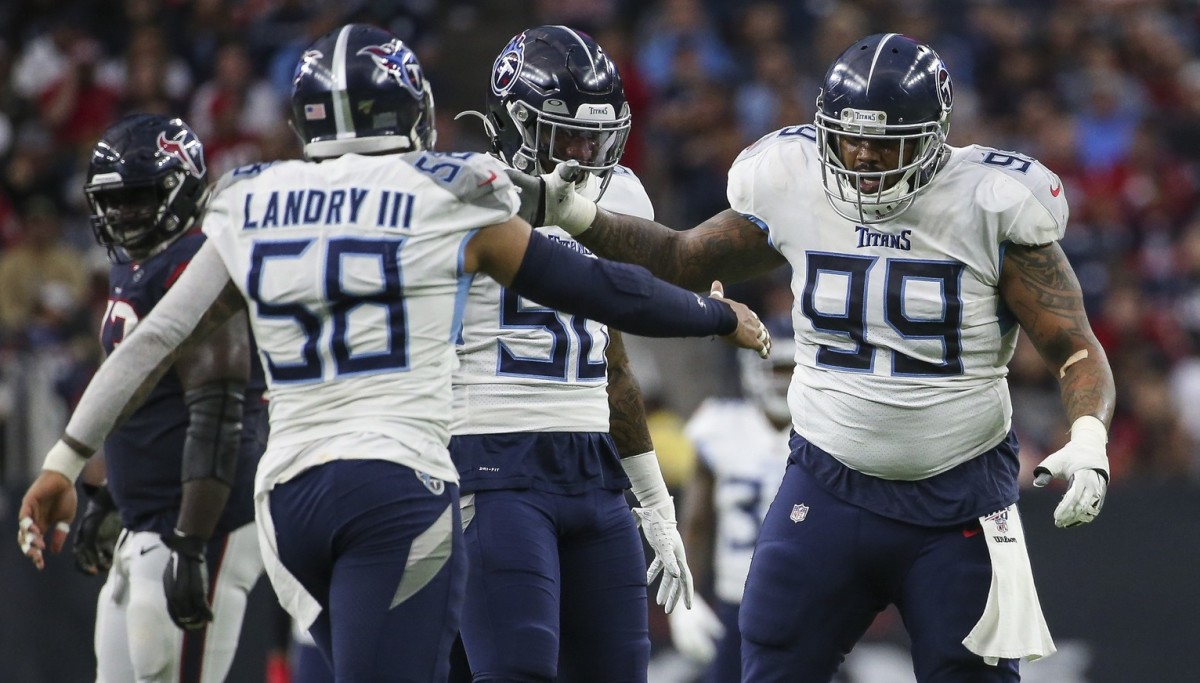 Tennessee Titans defensive end Jurrell Casey (99) celebrates with linebacker Harold Landry (58) after making a sack during the second quarter against the Houston Texans at NRG Stadium.