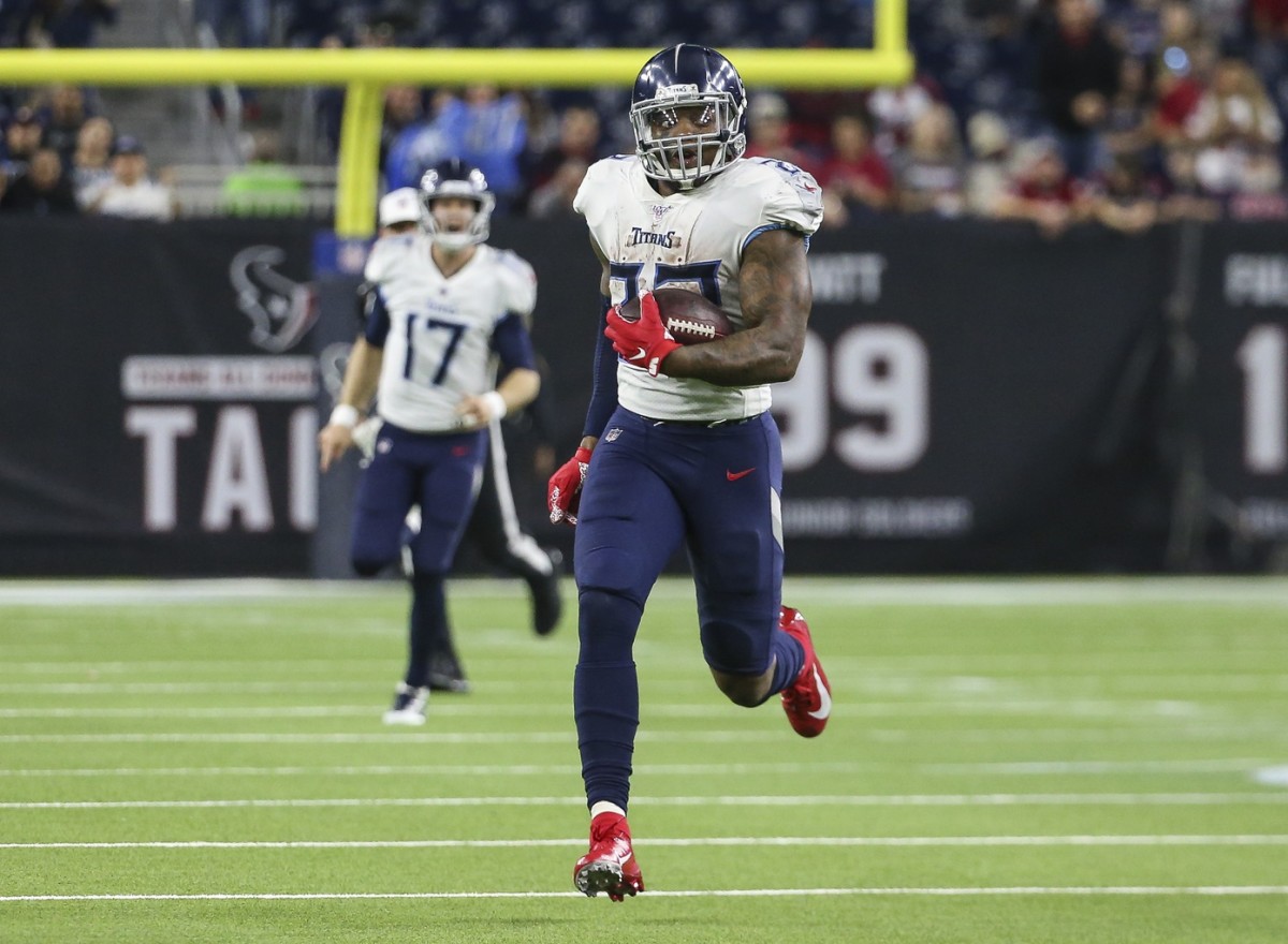 Tennessee Titans running back Derrick Henry (22) runs for a touchdown during the fourth quarter against the Houston Texans at NRG Stadium.